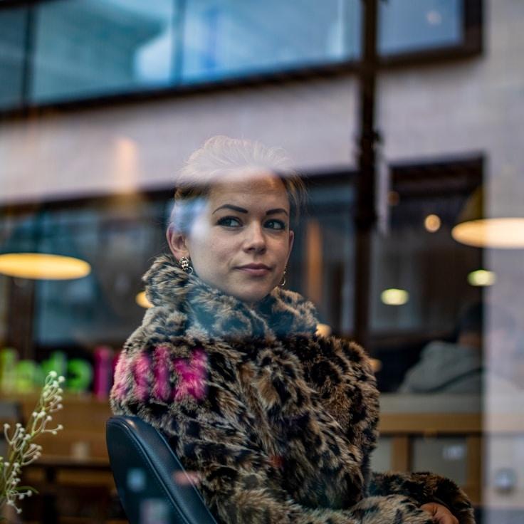 Nova Sen, Client Relations Director, discussing corporate gifting strategy with business clients